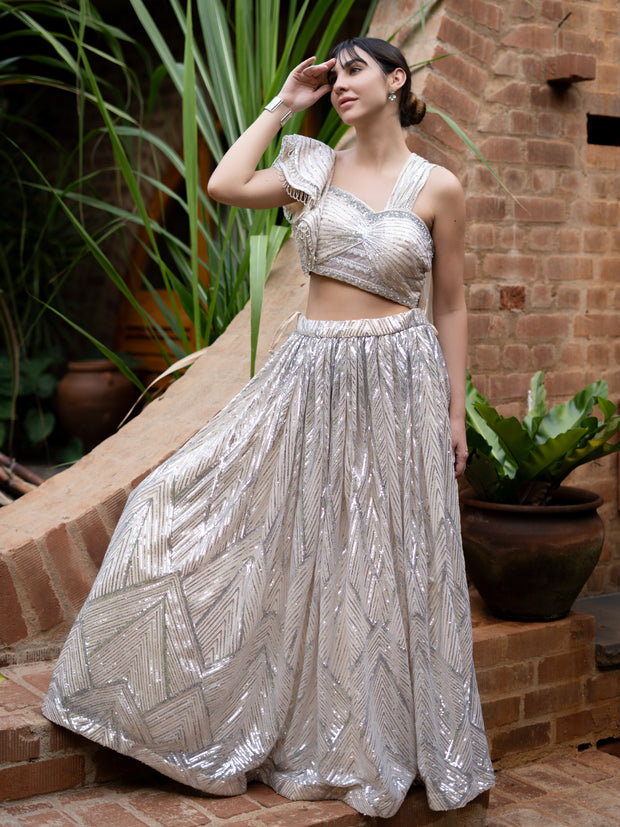 Silver corded lehenga set with one shoulder structured blouse and attached falling dupatta- Powder white